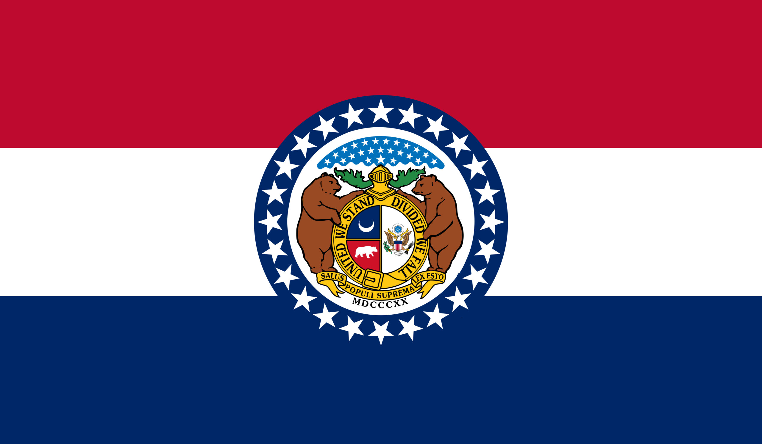 Missouri state flag with the Great Seal of Missouri at the center. The seal includes two bears around a gold circle saying "United We Stand, Divided We Fall" and the Latin phrase below.